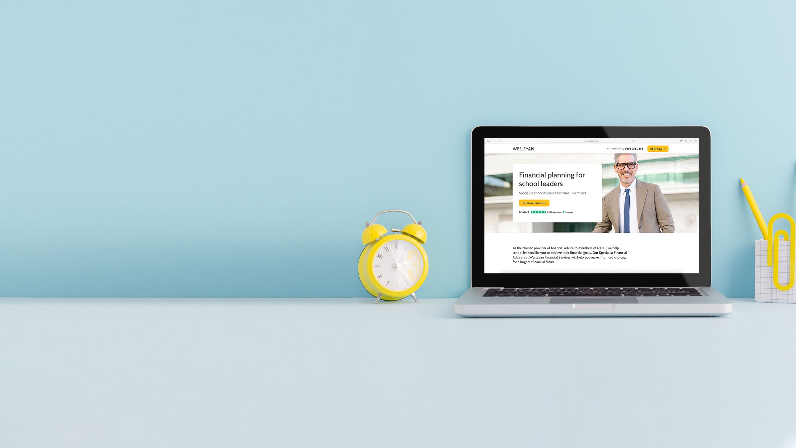 Laptop on a desk displaying homepage screens of relevant partner websites.