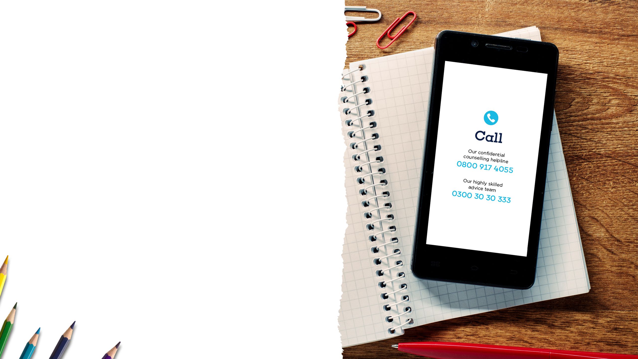 Smartphone on a table displaying advice and support information on the screen.